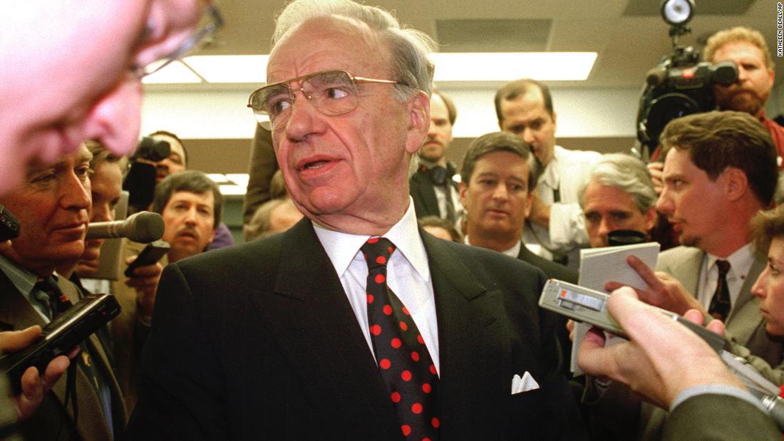 Murdoch is followed by reporters as he arrives for a hearing of the Federal Communications Commission in 1995. The FCC ruled 5-0 that Murdoch&#39;s Fox Network did not deliberately conceal information about its ownership structure a decade earlier. The decision permitted Murdoch to keep all eight television station licenses he held at the time.