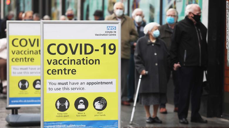 People queue before receiving the Oxford/AstraZeneca vaccine in Folkestone, southern England on January 27.