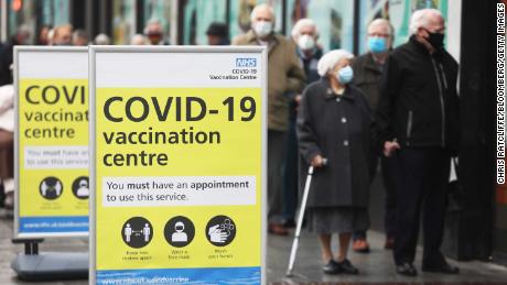 People queue before receiving the Oxford/AstraZeneca vaccine in Folkestone, southern England on January 27.