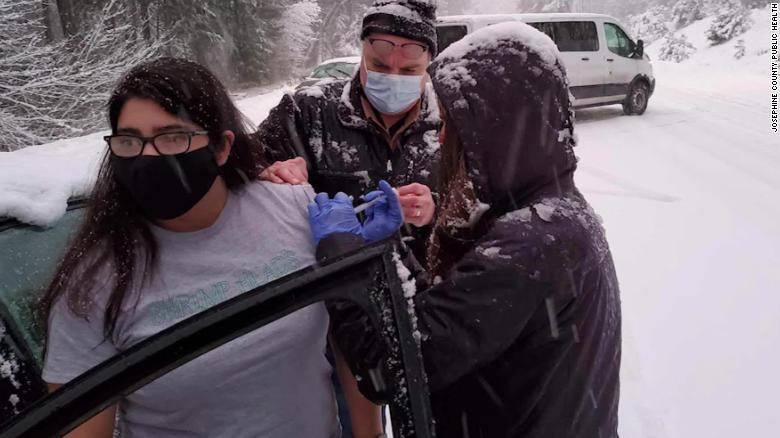 Healthcare workers stranded in snow give out vaccine doses set to expire