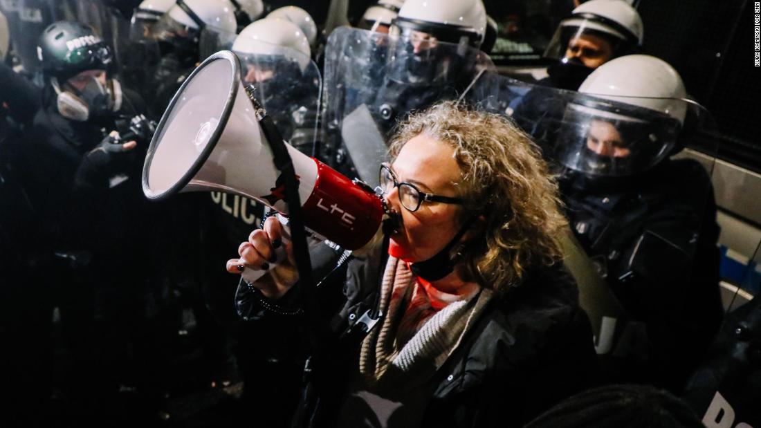 Women's Strike leader Marta Lempart rallied the protesters as they marched on Friday.