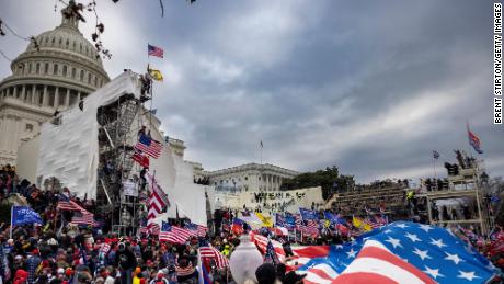 Federal prosecutors top 180 Capitol riot cases, with man seen in &#39;American Supremacist&#39; sweatshirt among the latest 