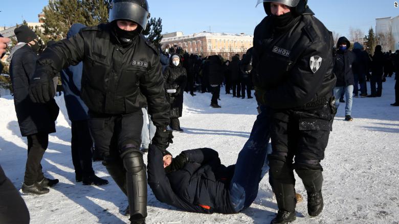 Police detain a man during a protest in support of Navalny in the Siberian city of Omsk on Sunday.