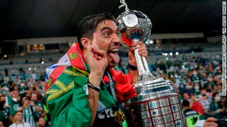 Palmeiras&#39; coach Abel Ferreira celebrates with the trophy after winning the Copa Libertadores. 