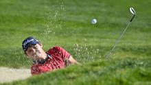 Reed hits from the bunker on the 1st hole during the final round of the Farmers Insurance Open.