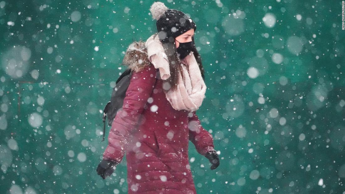 A person walks in Times Square on Monday.