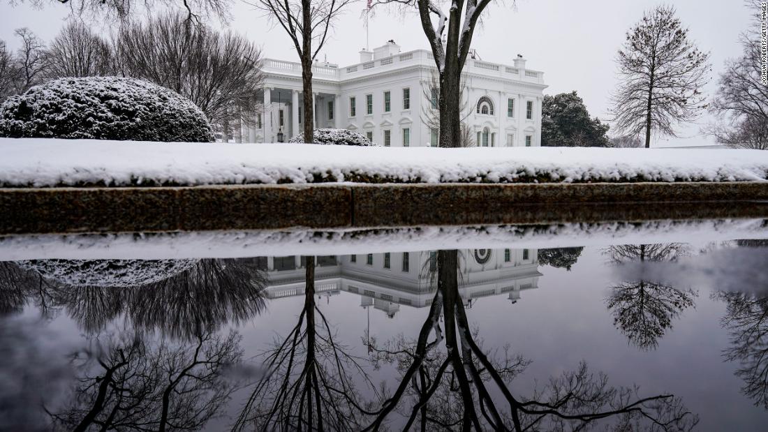 The White House grounds are covered in snow on Sunday.