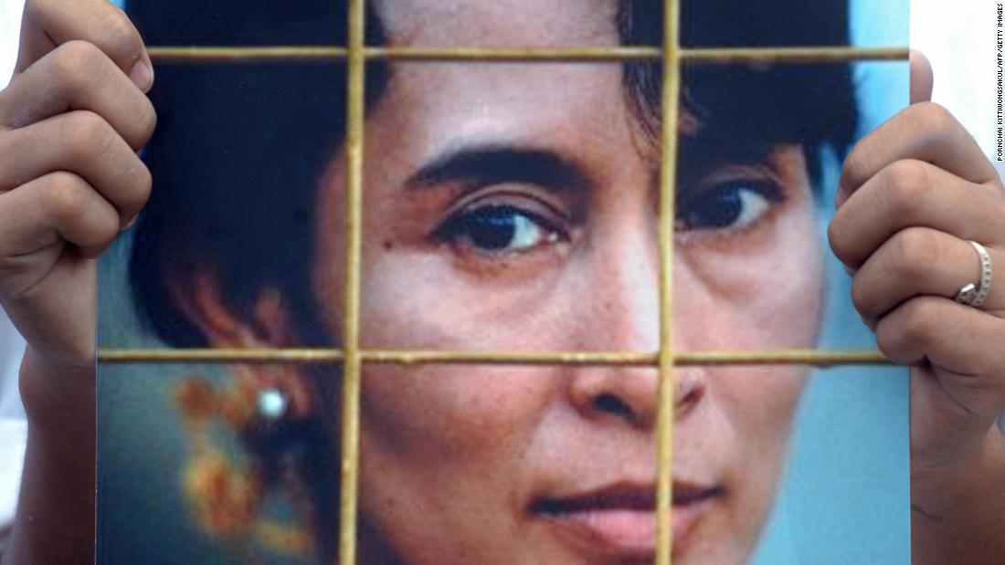 An activist holds a Suu Kyi portrait during a protest at the Chinese Embassy in Bangkok, Thailand, in 2009. The protesters were calling on the Chinese government to impose sanctions on Myanmar&#39;s military government following a Suu Kyi trial.