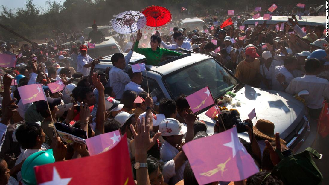 Suu Kyi greets crowds while campaigning in Pathein, Myanmar, in 2012. She was running for a seat in parliament.