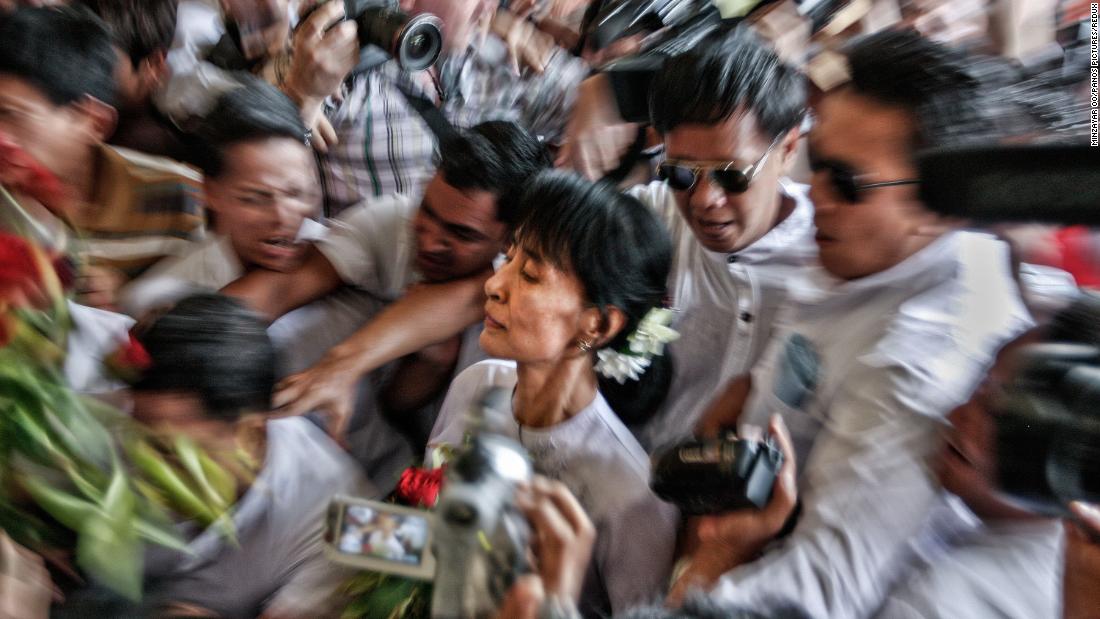 Suu Kyi makes her way through a crowd in 2012, a day after she won a seat in parliament. It was Myanmar&#39;s first multiparty elections since 1990.