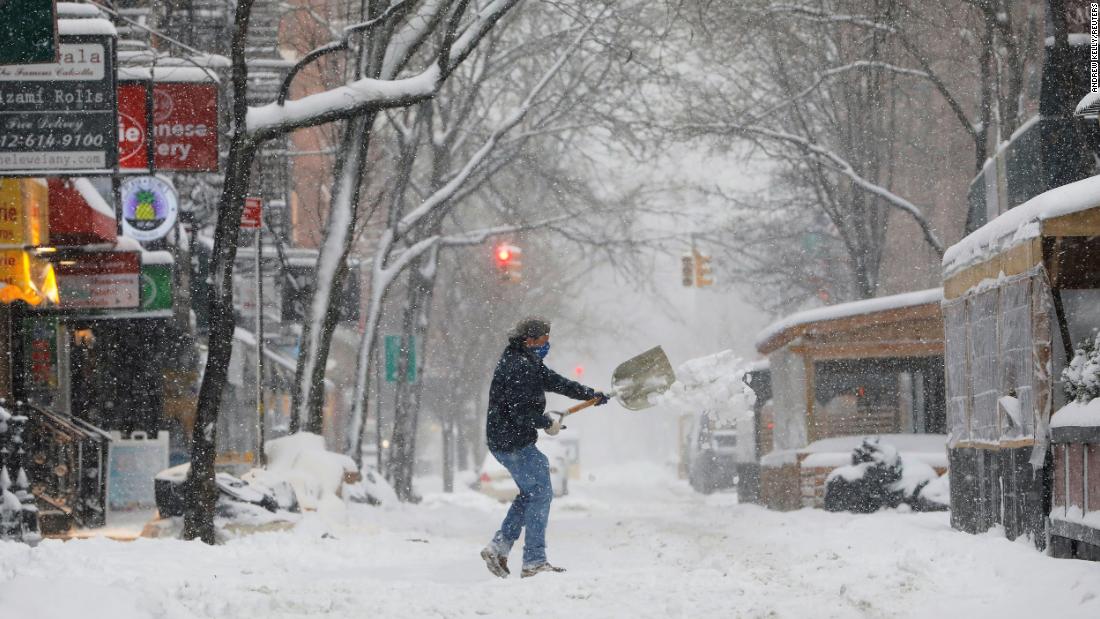 A person shovels snow Monday in the Greenwich Village neighborhood of New York.