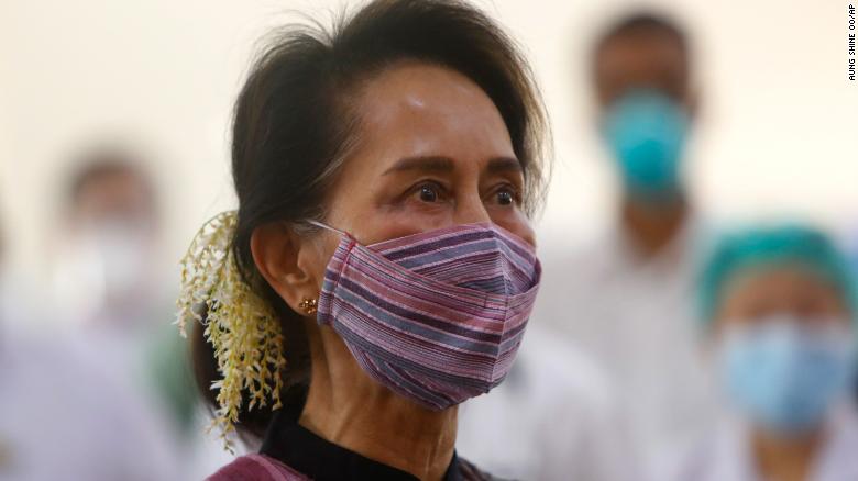 Suu Kyi watches the vaccination of health workers at a hospital in Naypyidaw in January 2021. A few days later, the military detained her in a coup.
