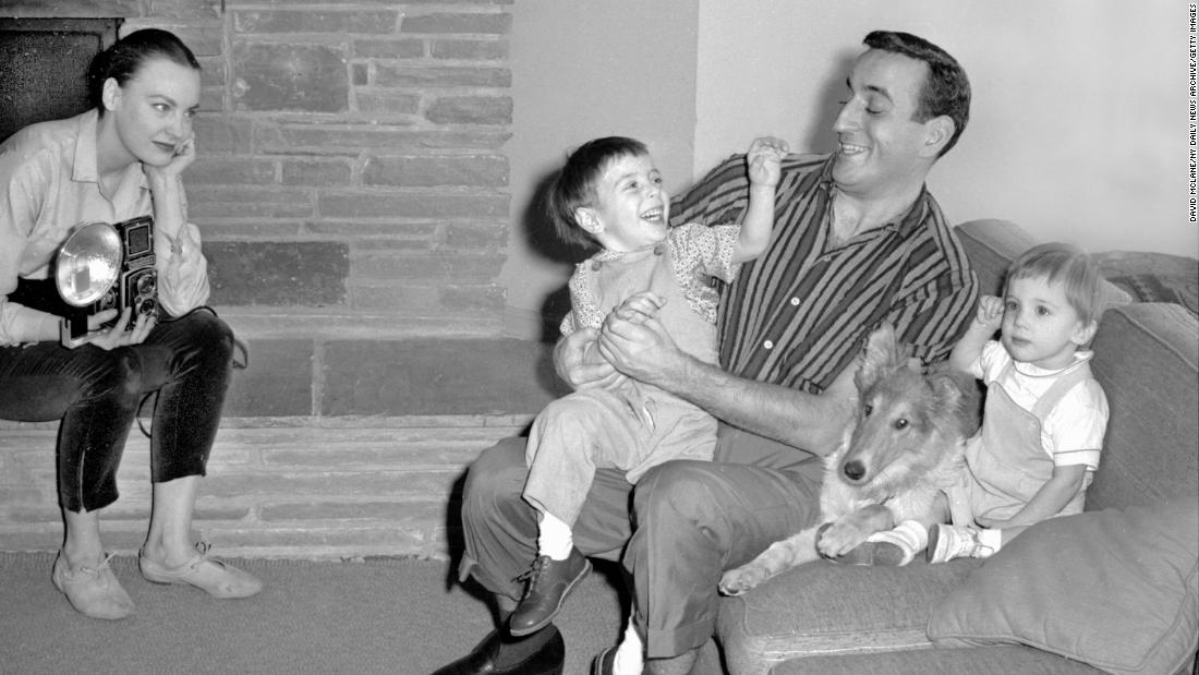 Bennett plays with his son D&#39;Andrea next to his son Daegal and Pat the collie in 1957. His wife, Patricia, is on the left. 