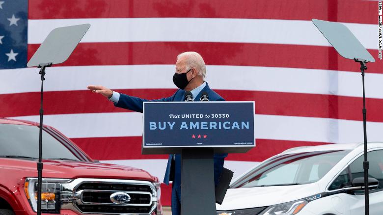 Joe Biden waves after speaking at United Auto Workers Union Headquarters in Warren, Michigan, on September 9, 2020. 