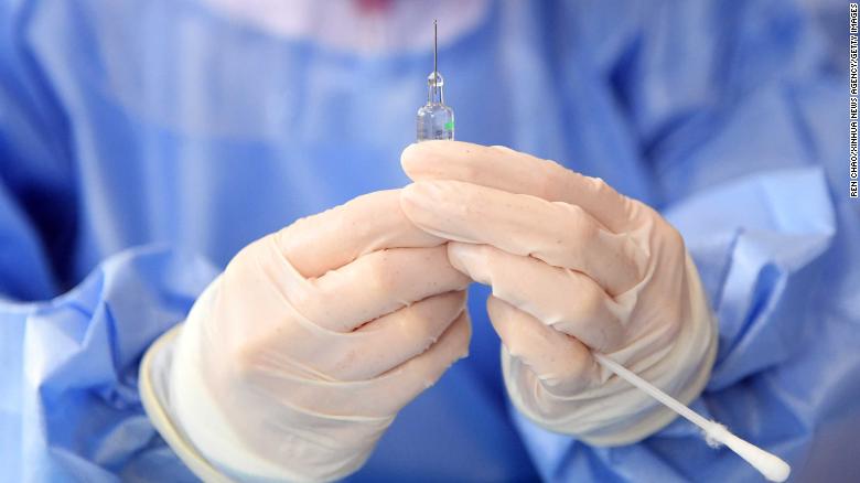 A medical worker prepares a dose of Covid-19 vaccine in Beijing, China.