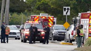 Law enforcement officers block an area where a shooting wounded several FBI while serving an arrest warrant, Tuesday, Feb. 2, 2021, in Sunrise, Florida.