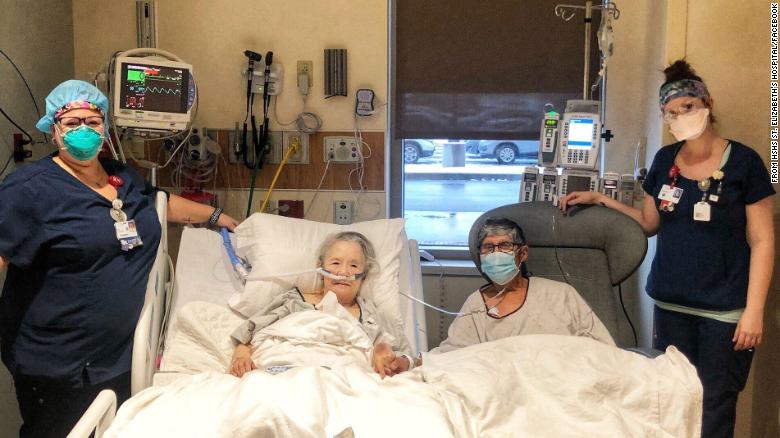 Hospital staff treat an elderly couple hospitalized with coronavirus to a dinner date together