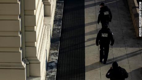 Capitol Police officers sweep the grounds of the U.S. Capitol building on January 7, 2021 in Washington, DC.