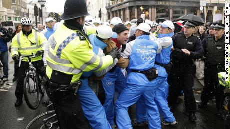 Protesters clash with police and Olympic security as the Torch Relay passes through London on April 6, 2008.