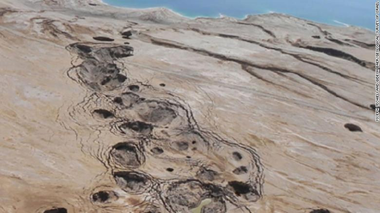 These sinkhole depressions were observed in mud flat sediments  near the Dead Sea in Israel.