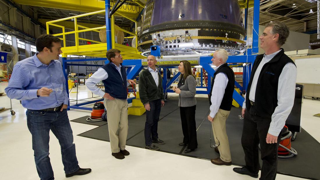 Bezos, third from left, meets with NASA Deputy Administrator Lori Garver at the Blue Origin headquarters in Kent, Washington, in 2011. Bezos&#39; Blue Origin was started in 2000 with the goal of providing low-cost access to private space travel.