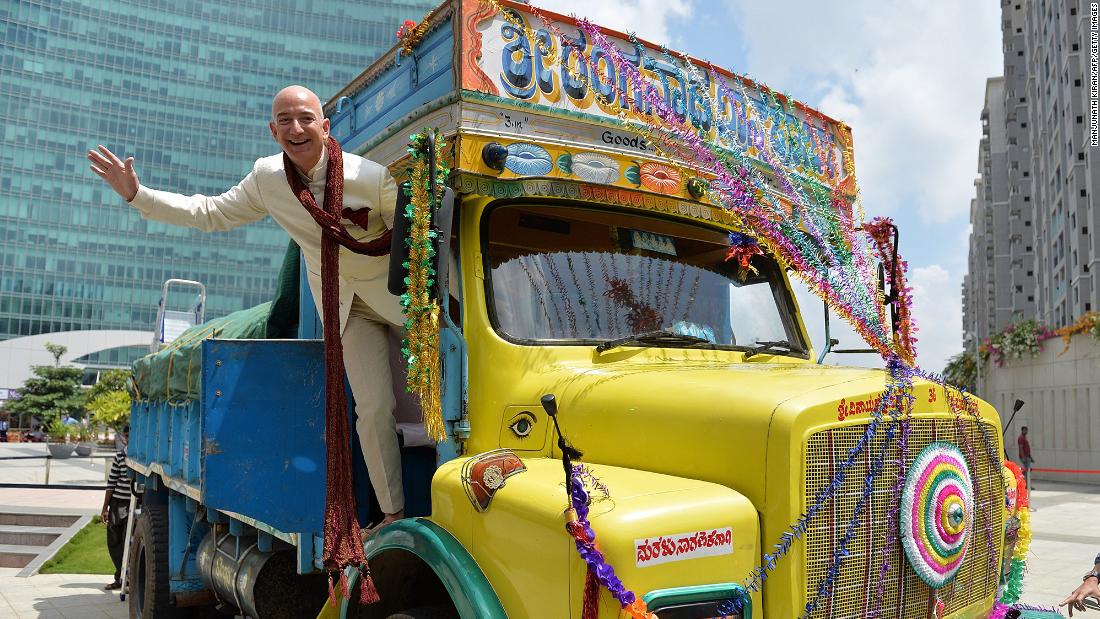Bezos poses on a truck while visiting Bangalore, India, in 2014.