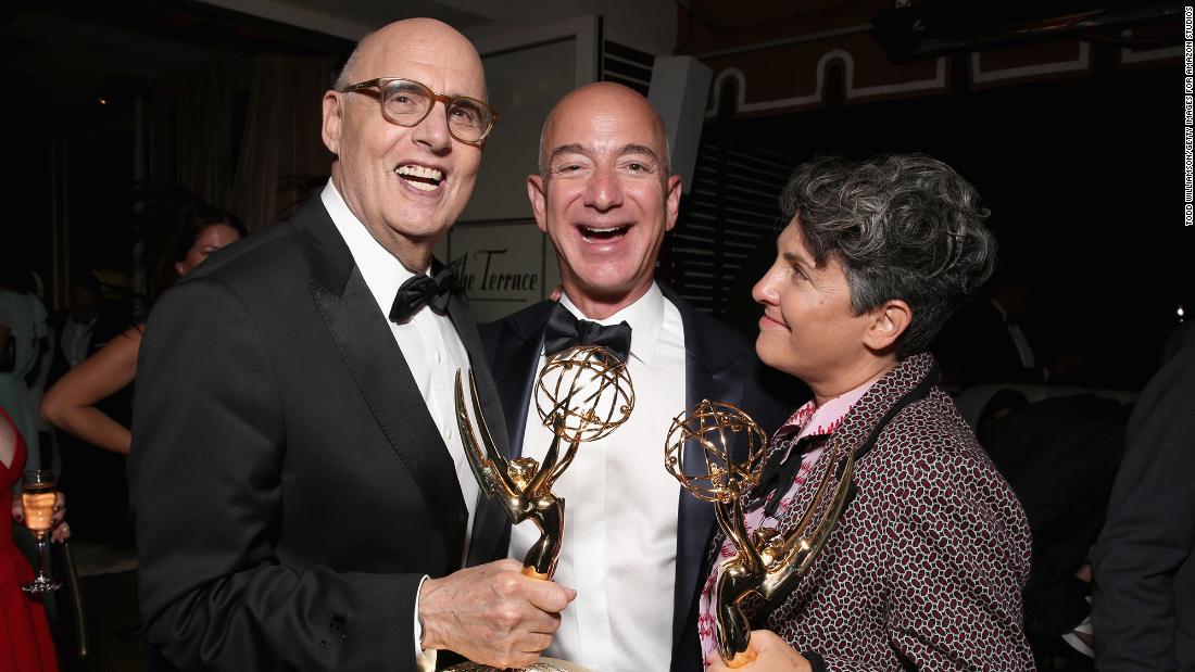 Bezos joins &quot;Transparent&quot; actor Jeffrey Tambor and director Jill Soloway after the Amazon Studios show won Emmys in 2016.