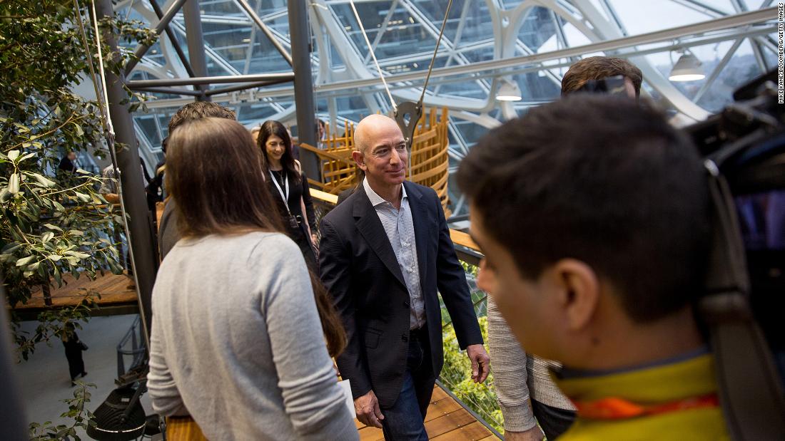 Bezos tours the Spheres, a gathering and working space for Amazon employees, at its opening ceremonies in Seattle in 2018. The space contains hundreds of plant species from cloud forest environments around the globe, and it maintains a tropical climate similar to Costa Rica or Indonesia. 