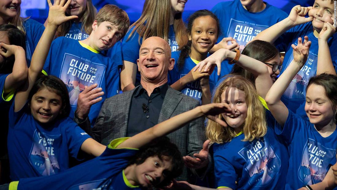 Bezos is joined by the children from the Blue Origin Club for the Future in 2019. At the event in Washington, DC, Bezos unveiled a Blue Origin prototype of a lunar lander.