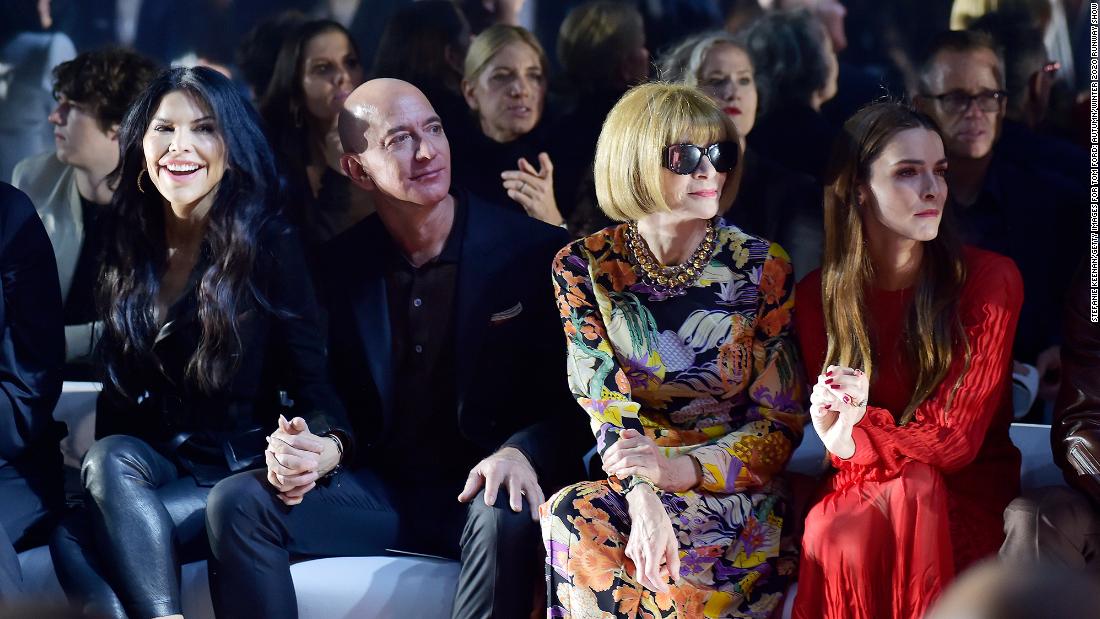Bezos sits between his girlfriend, Lauren Sánchez, and Vogue magazine editor Anna Wintour at a Tom Ford fashion show in Los Angeles in February 2020.