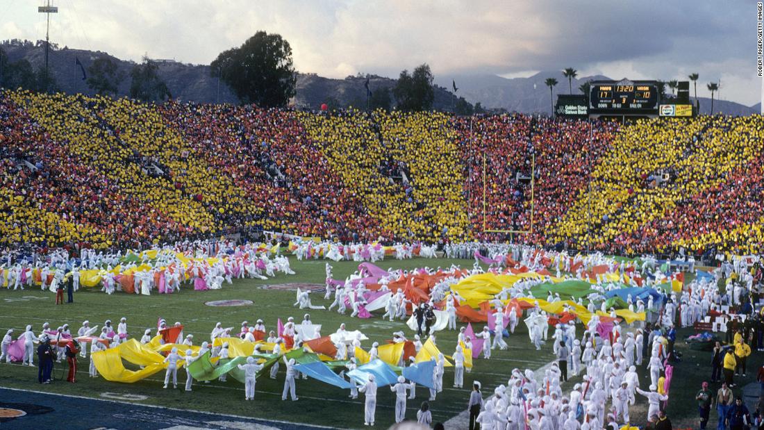 The crowd contributes a colorful background to the Super Bowl halftime show in 1983, which was held at the Rose Bowl in Pasadena, California.