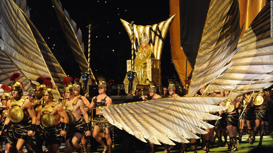 Madonna, clad as a Roman goddess, is carried to the stage in 2012.