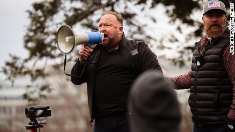 Alex Jones, the founder of right-wing media group Infowars, addresses a crowd of pro-Trump protesters after they storm the grounds of the Capitol Building on January 6, 2021 in Washington, DC.