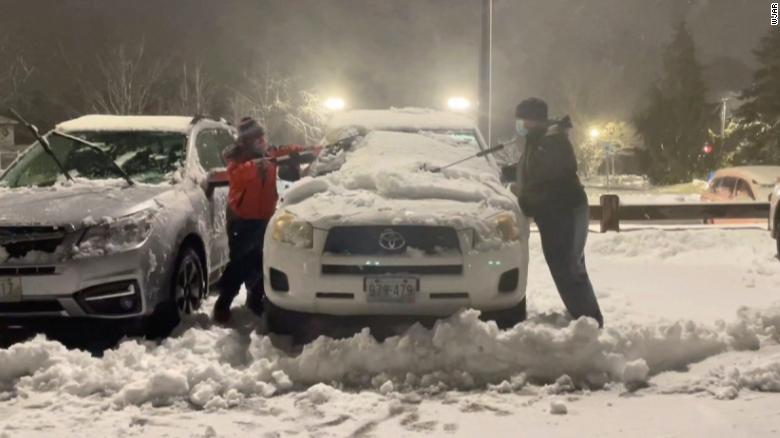 A 10-year-old boy and family friend cleaned snow off 80 hospital workers’ cars during storm