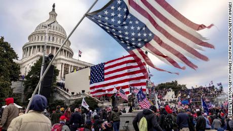 WASHINGTON, DC - JANUARY 6: Pro-Trump protesters gather in front of the U.S. Capitol Building on January 6, 2021 in Washington, DC. Trump supporters gathered in the nation&#39;s capital to protest the ratification of President-elect Joe Biden&#39;s Electoral College victory over President Trump in the 2020 election. A pro-Trump mob later stormed the Capitol, breaking windows and clashing with police officers. Five people died as a result.  (Photo by Brent Stirton/Getty Images)