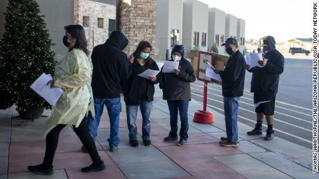 People line up at a Navajo Nation senior care center in Chinle, Ariz. To receive the Covid-19 vaccine on December 18, 2020.