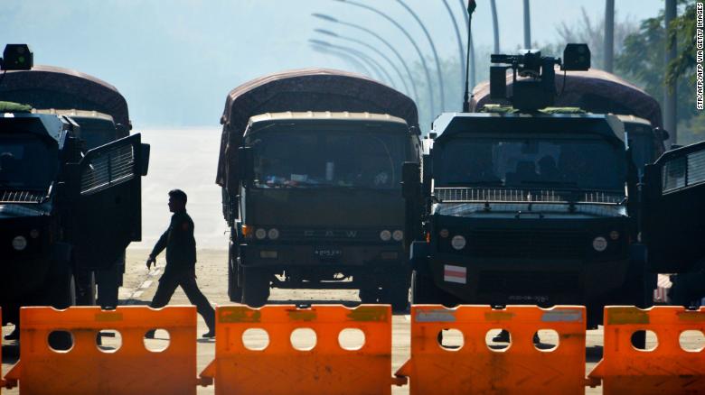 Soldiers stand guard along a blockaded road near Myanmar&#39;s Parliament in Naypyidaw on February 2, 2021.