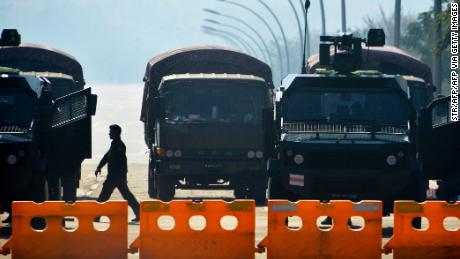 Soldiers stand guard along a blockaded road near Myanmar&#39;s Parliament in Naypyidaw on February 2, 2021.