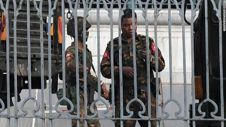 Soldiers keep watch inside the City Hall compound in Yangon on February 1, 2021.