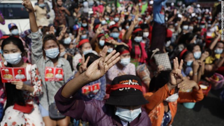 Protesters flash the three-finger salute during a demonstration against the military coup in Yangon, Myanmar, February 6.