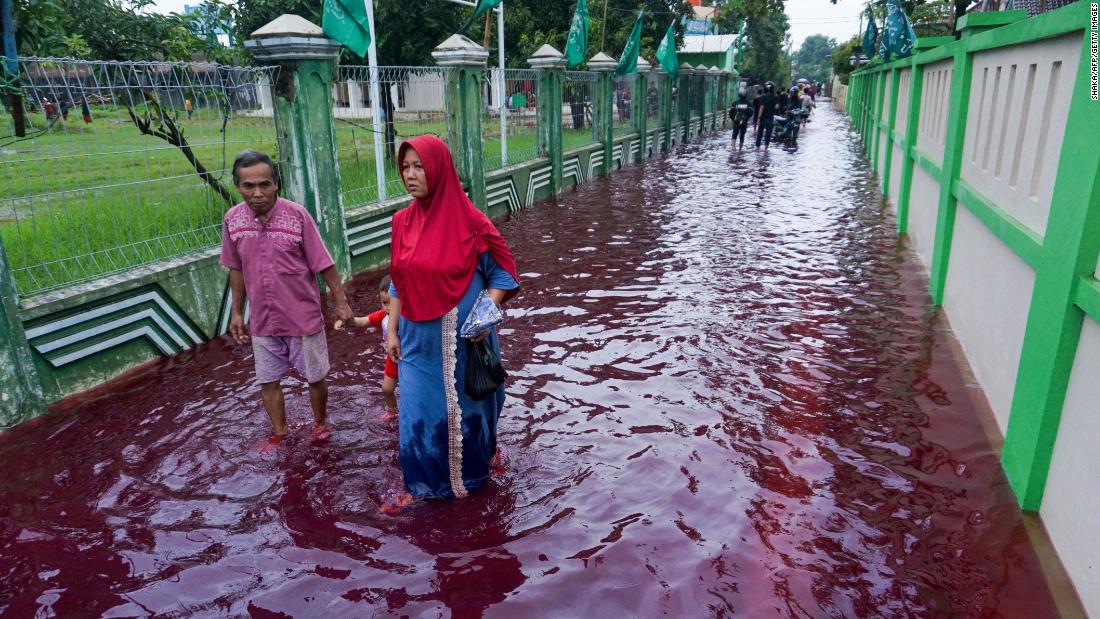 Indonesian town turns red as floods hit batik production center