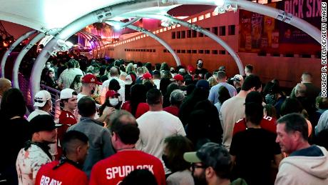 Fans walk along the riverwalk in preparation for Super Bowl LV on February 6, 2021 in Tampa, Florida