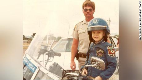 Frank Shankwitz is seen with 7-year-old Chris Greicius, who inspired Shankwitz and others to found the Make-A-Wish Foundation.