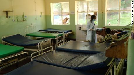Dr. Tamara Phiri consults with a patient in a general ward. 