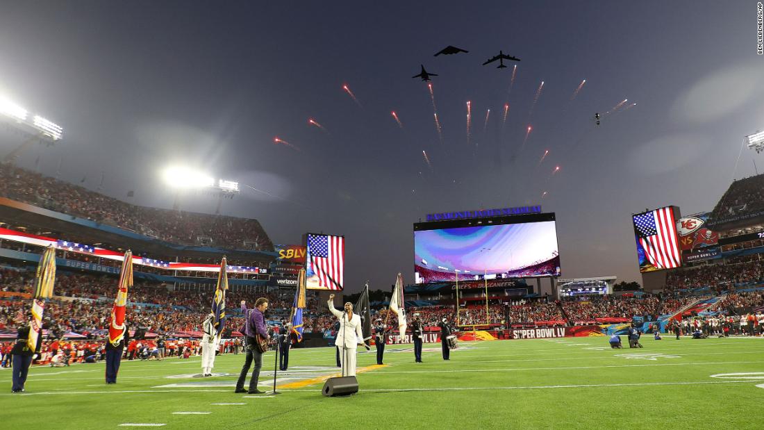 Jets fly over Raymond James Stadium as Eric Church and Jazmine Sullivan perform the National Anthem before the game.