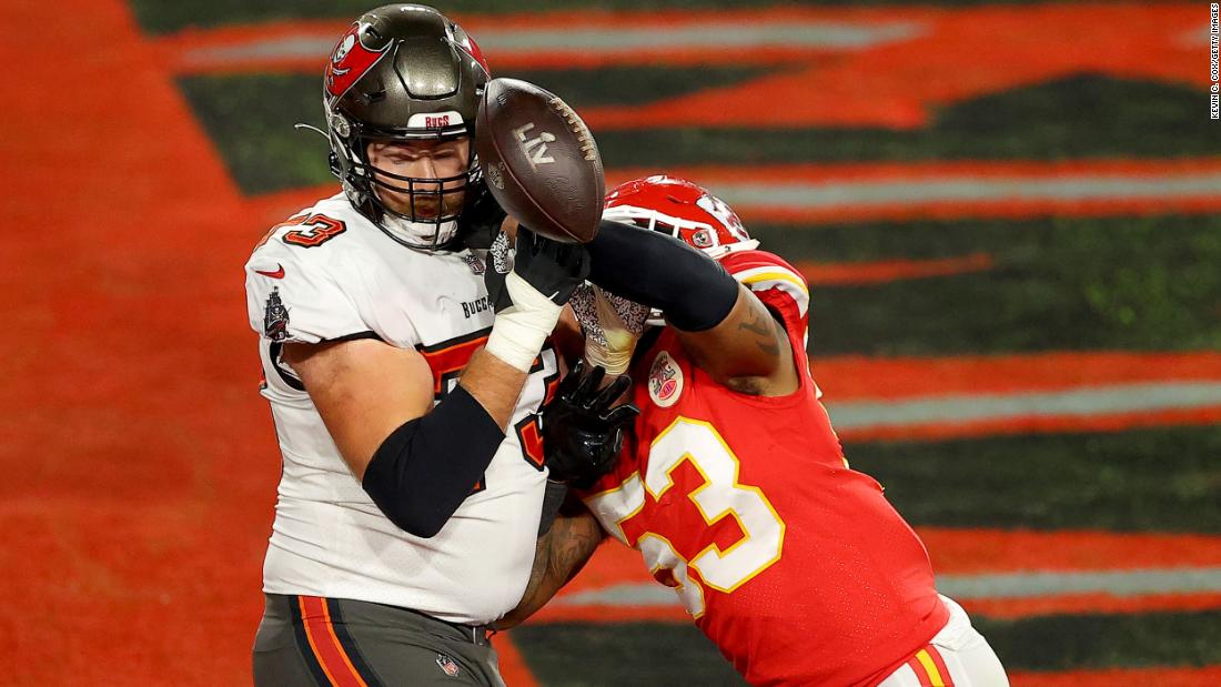 Kansas City linebacker Anthony Hitchens punches the ball away from Tampa Bay&#39;s Joe Haeg just prior to the Chiefs&#39; stop on 4th-and-goal.