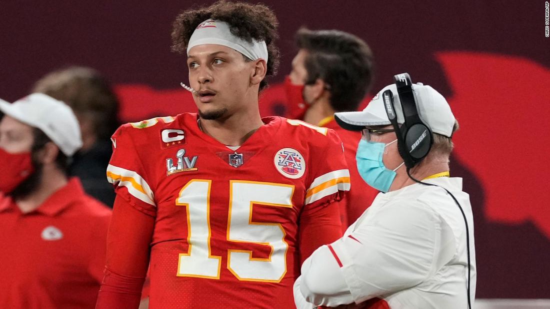 Mahomes watches from the sideline late in the second half.