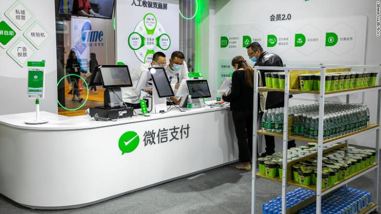 Tencent&#39;s WeChat Pay — seen here at the China Retail Trade Fair in November 2020 — is Alipay&#39;s main rival. 