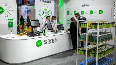 Tencent&#39;s WeChat Pay — seen here at the China Retail Trade Fair in November 2020 — is Alipay&#39;s main rival. 