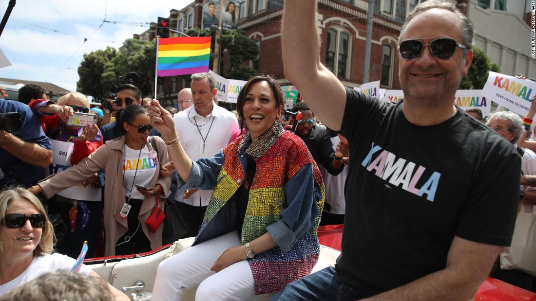 Then-Sen. Kamala Harris and husband Douglas Emhoff wave during the SF Pride Parade on June 30, 2019, in San Francisco.